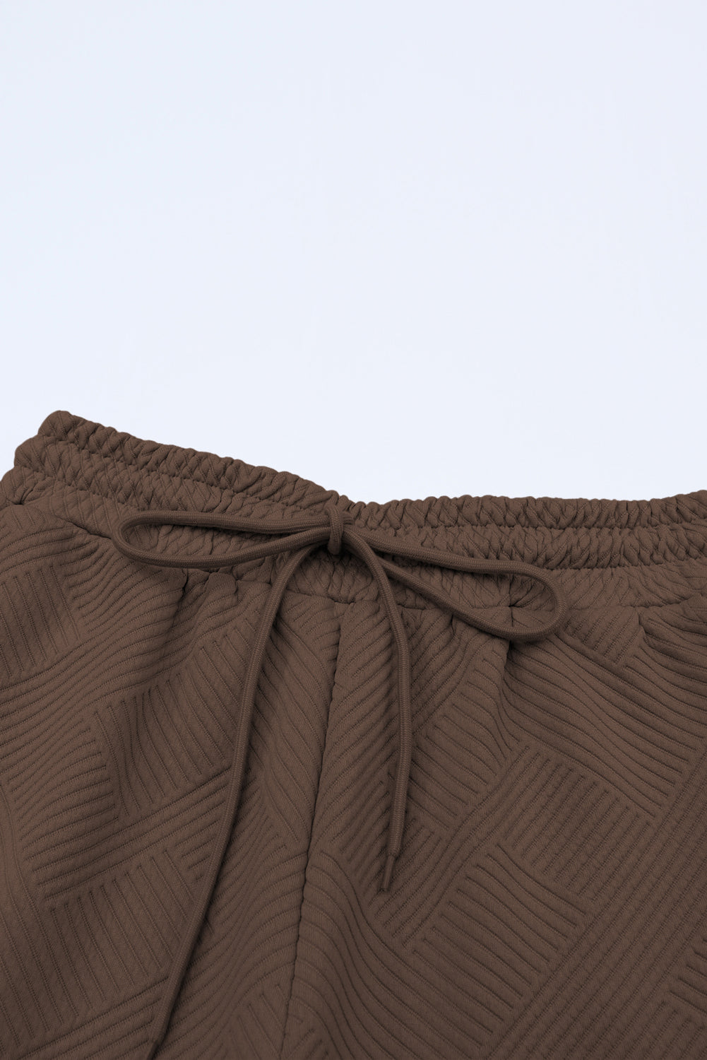 Schwarzes, strukturiertes, locker sitzendes T-Shirt und Hose mit Kordelzug