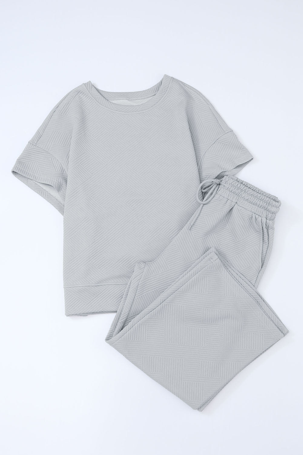Schwarzes, strukturiertes, locker sitzendes T-Shirt und Hose mit Kordelzug