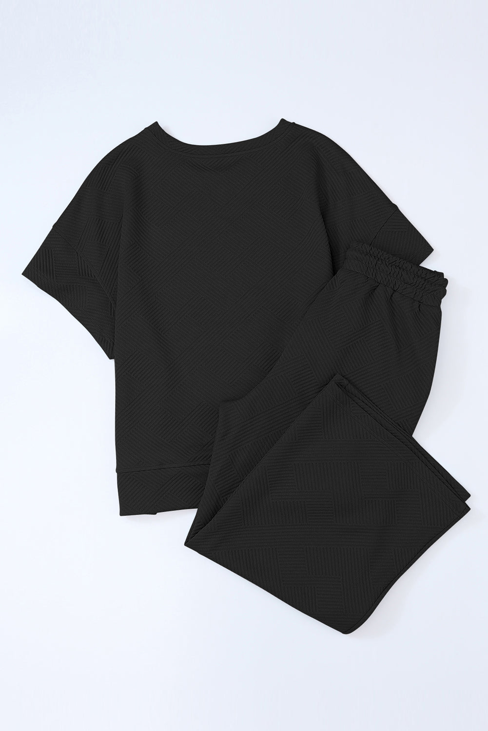 Schwarzes, strukturiertes, locker sitzendes T-Shirt und Hose mit Kordelzug