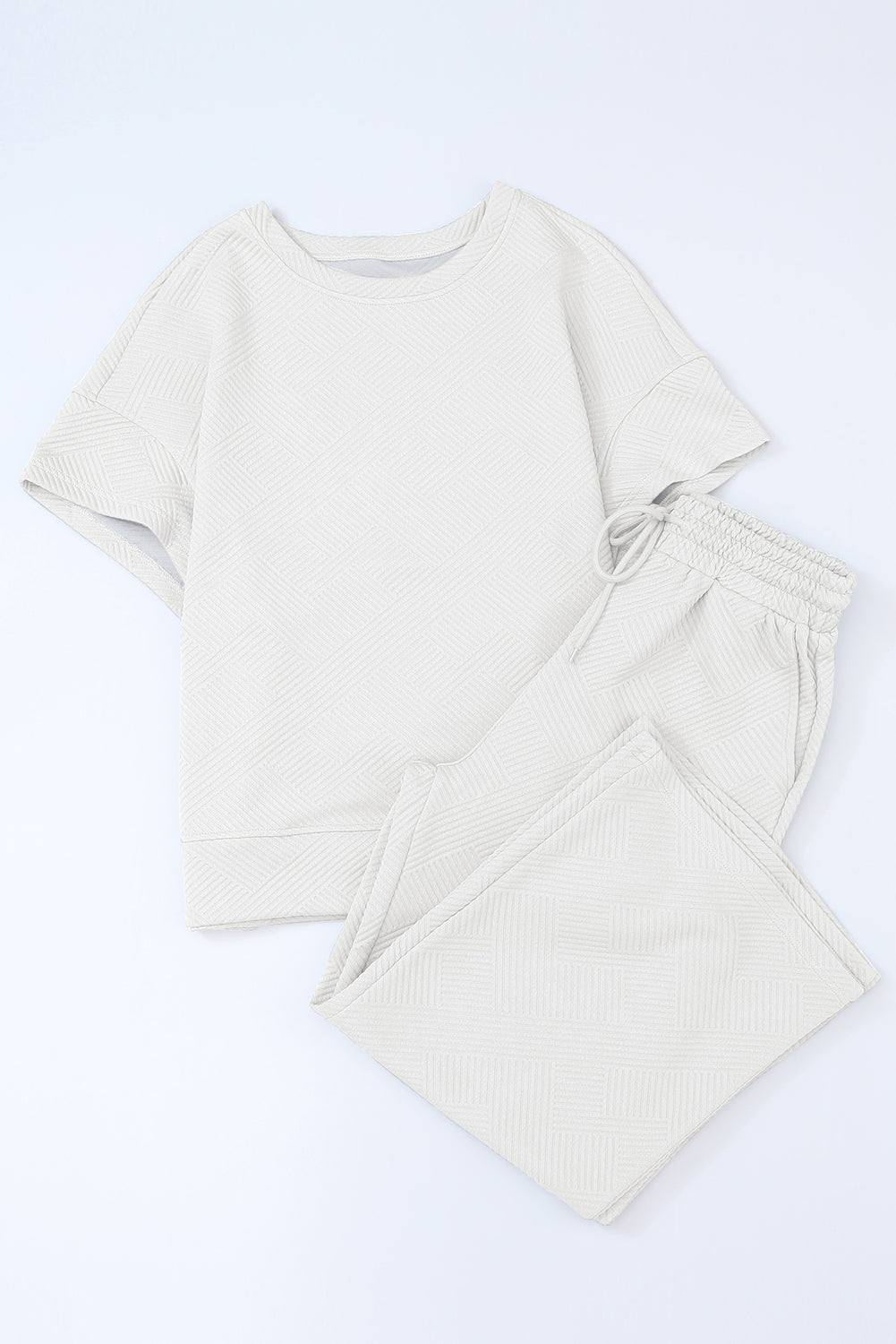 Schwarzes, strukturiertes, locker sitzendes T-Shirt und Hose mit Kordelzug