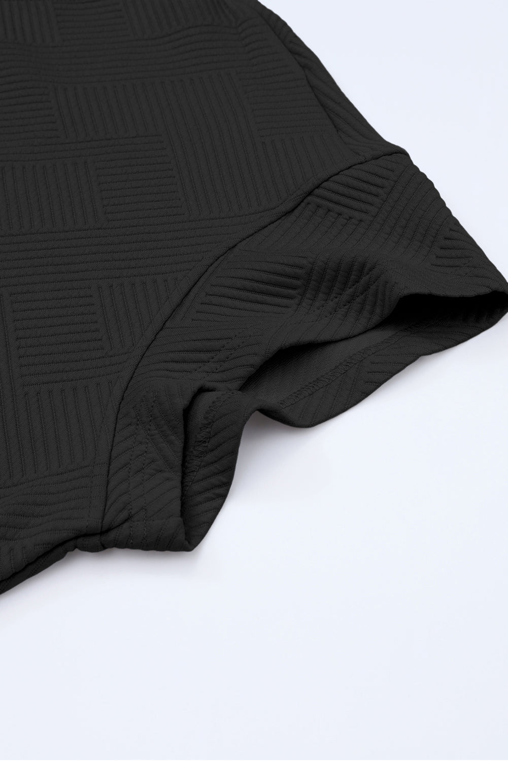 Schwarzes, strukturiertes, locker sitzendes T-Shirt und Hose mit Kordelzug