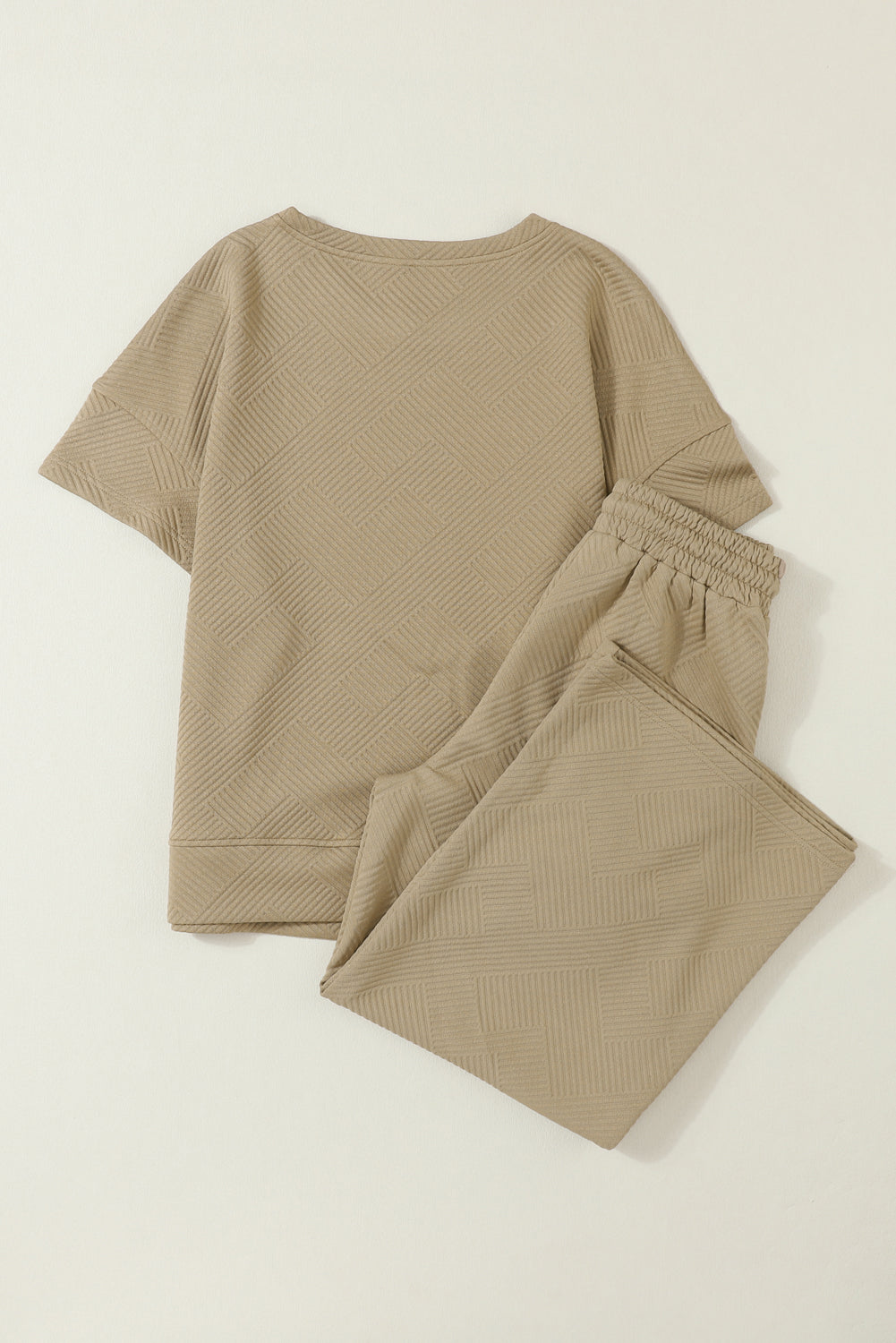 Schwarzes, strukturiertes, locker sitzendes T-Shirt und Hose mit Kordelzug