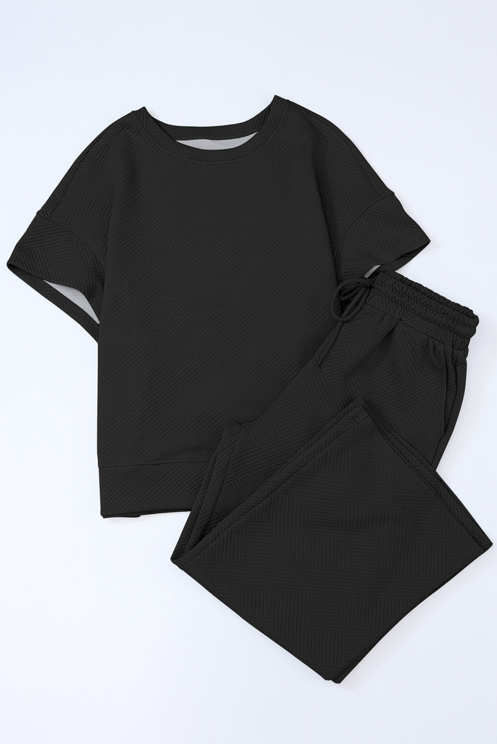 Schwarzes, strukturiertes, locker sitzendes T-Shirt und Hose mit Kordelzug