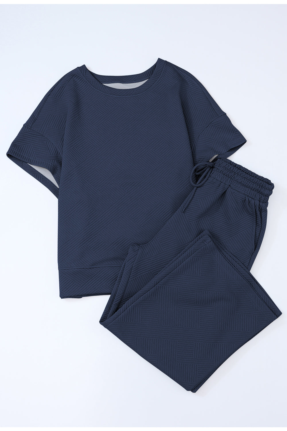 Schwarzes, strukturiertes, locker sitzendes T-Shirt und Hose mit Kordelzug
