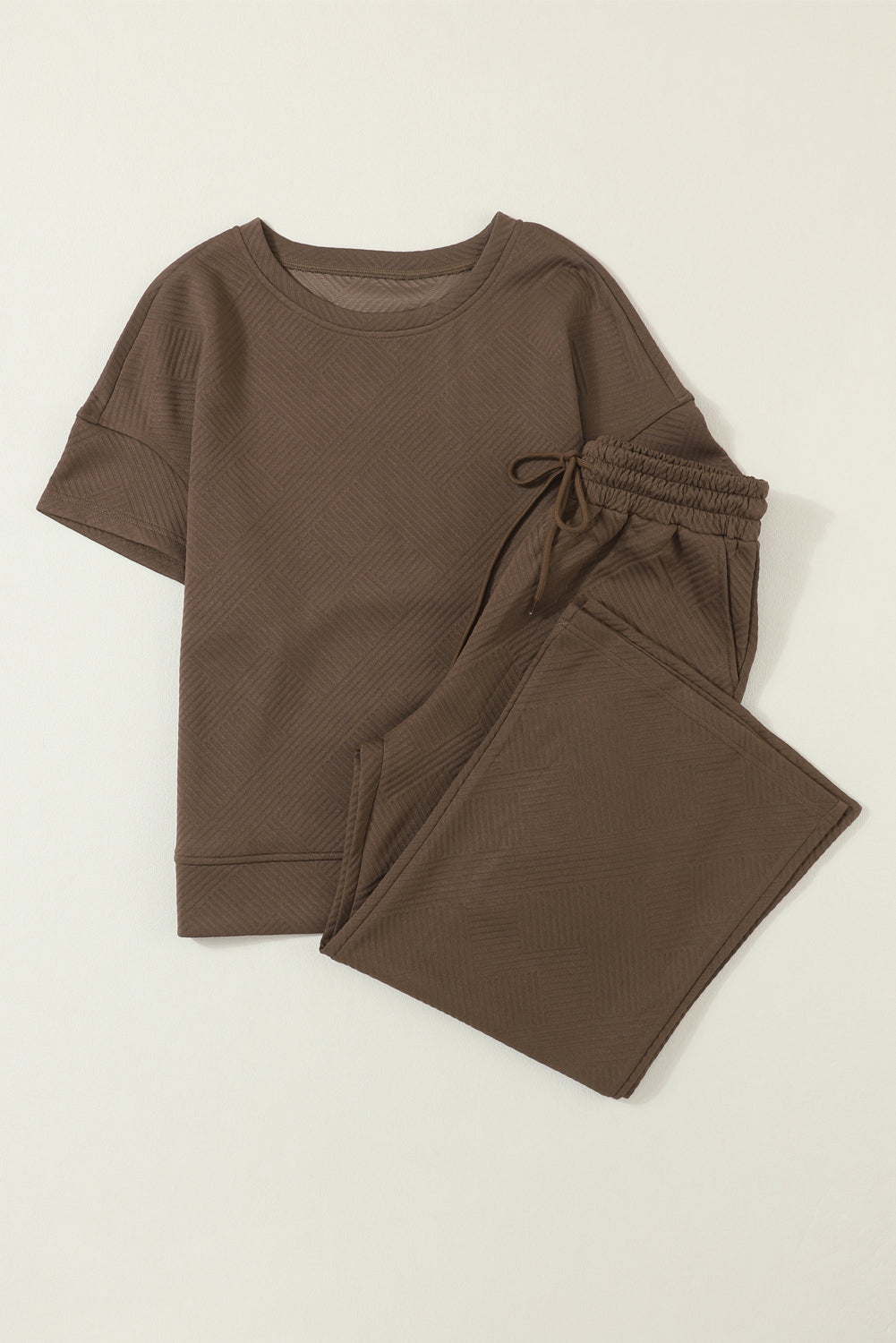 Schwarzes, strukturiertes, locker sitzendes T-Shirt und Hose mit Kordelzug