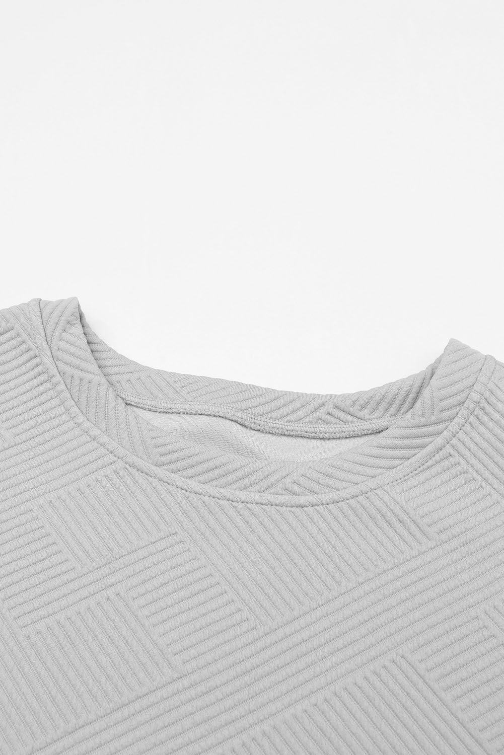 Schwarzes, strukturiertes, locker sitzendes T-Shirt und Hose mit Kordelzug